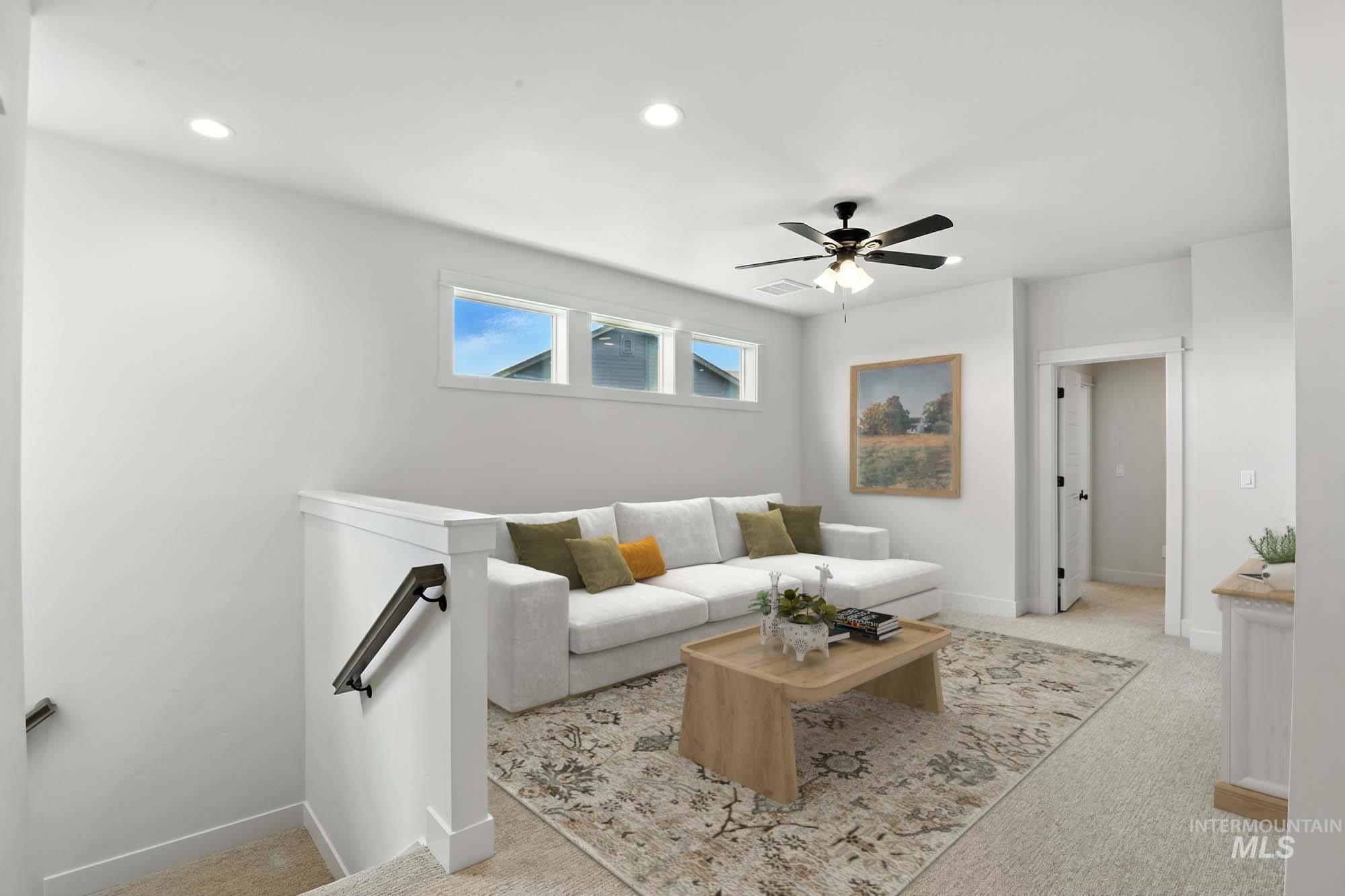 Living room featuring carpet floors, recessed lighting, and a ceiling fan