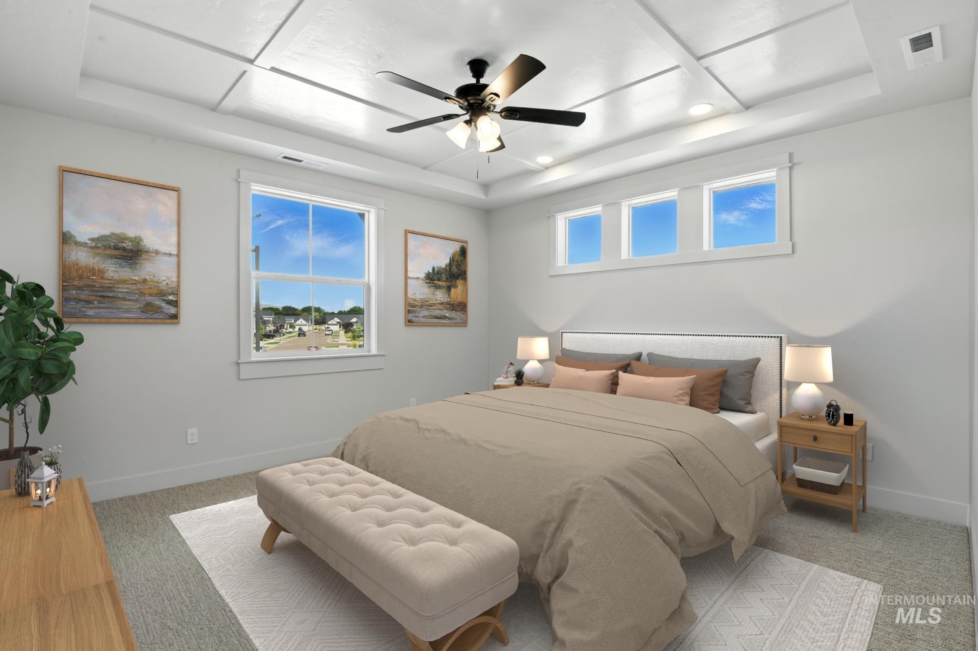 Bedroom with a tray ceiling, light colored carpet, ceiling fan, and recessed lighting