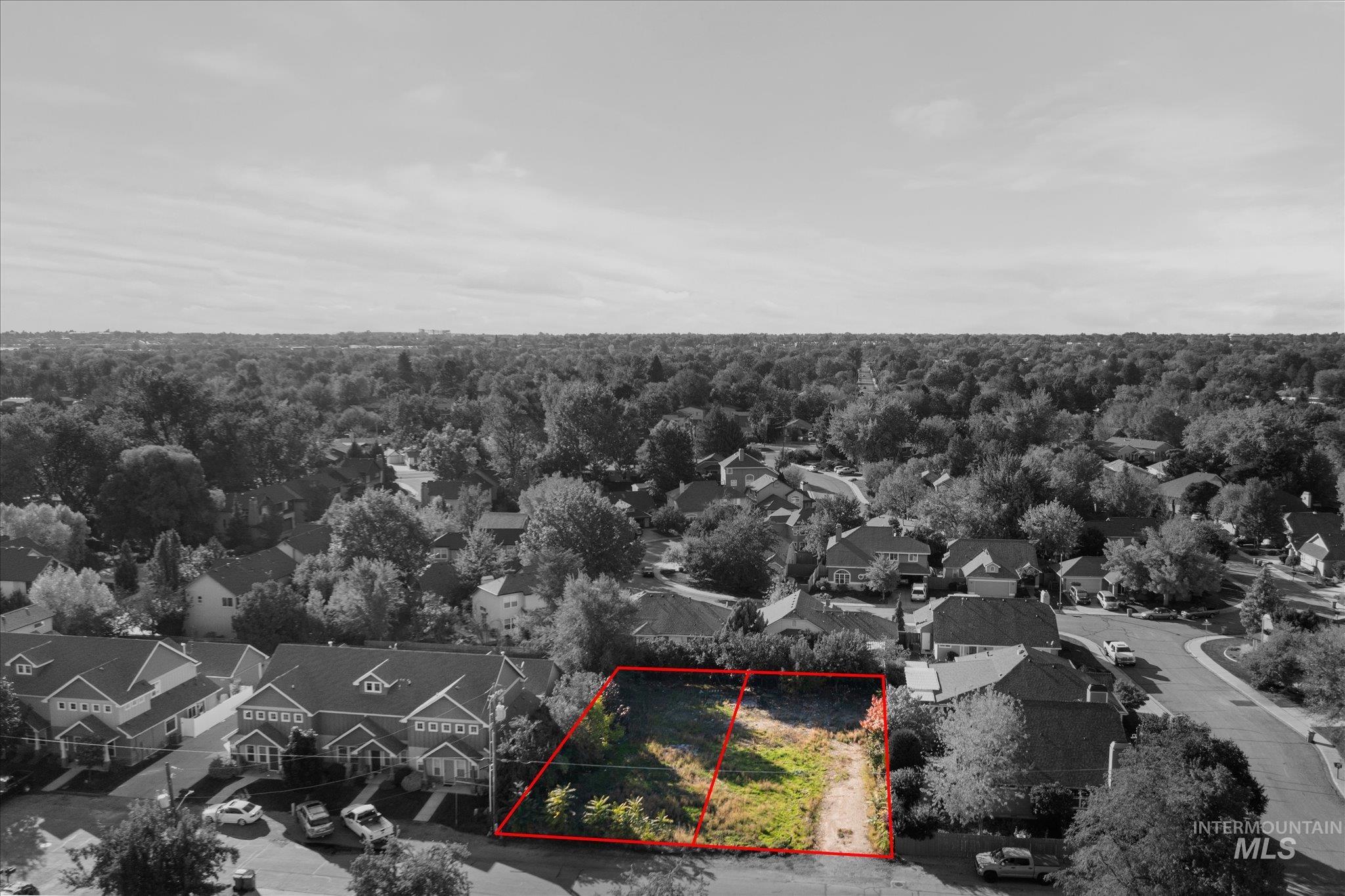 Aerial perspective of suburban area featuring property parcel outlined