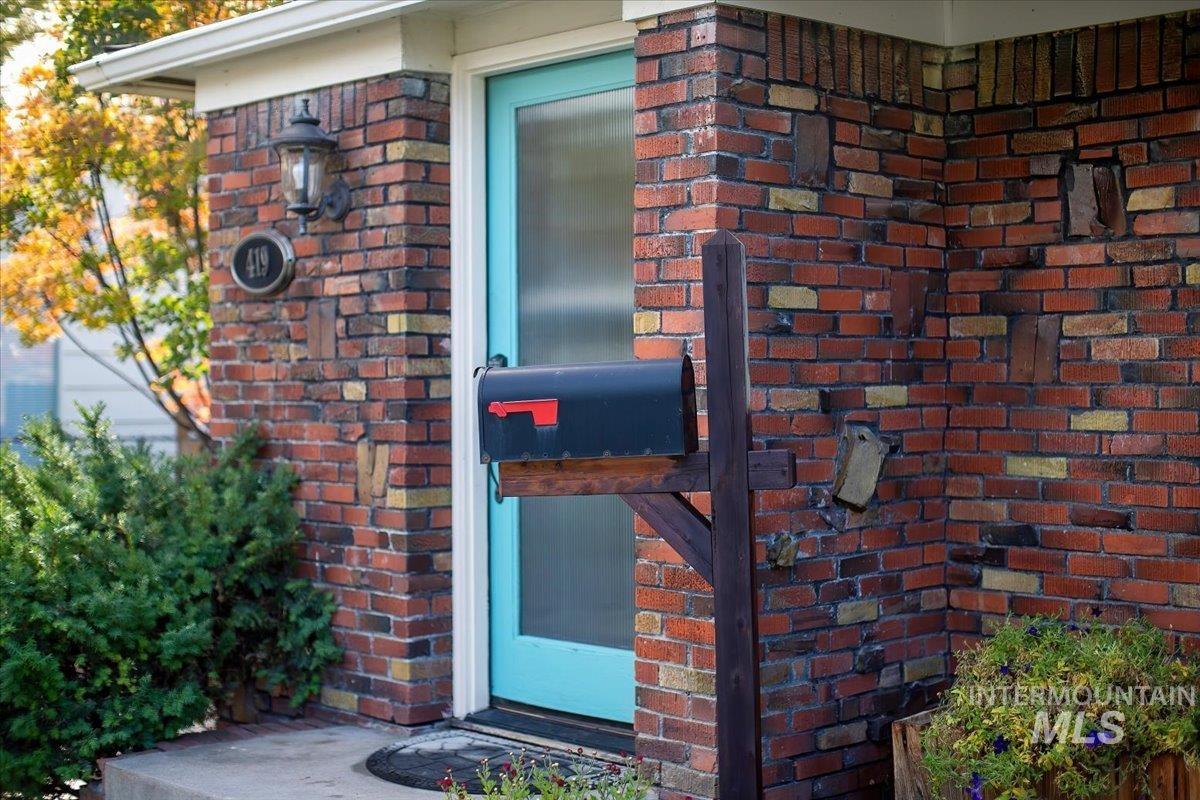 Property entrance with brick siding