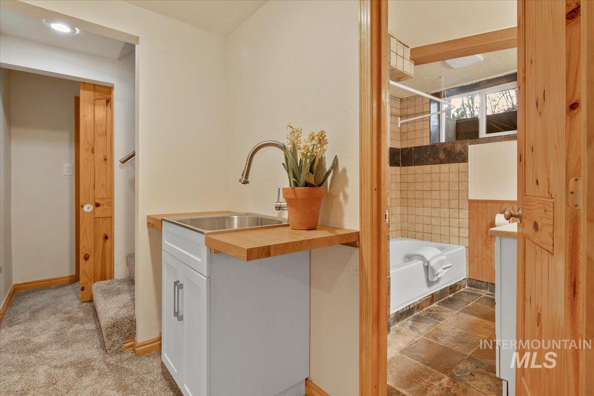 Full bath with shower / bath combination and vanity