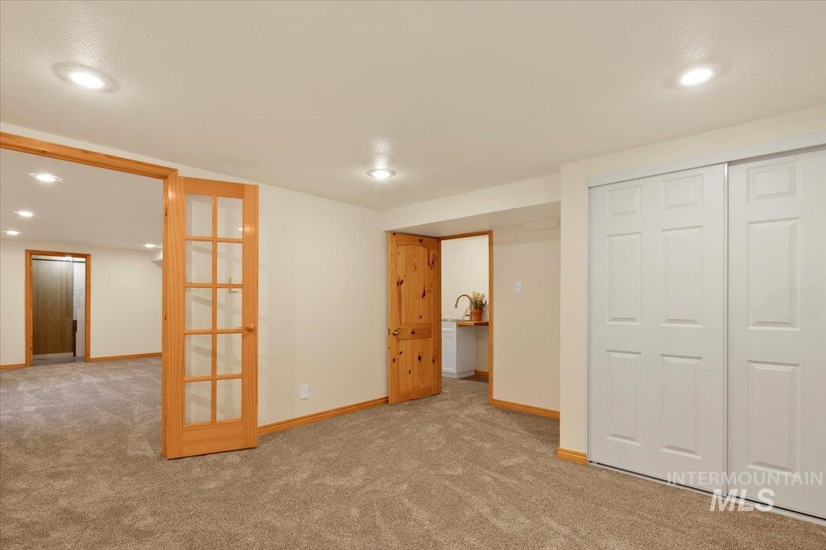 Unfurnished bedroom with recessed lighting and carpet