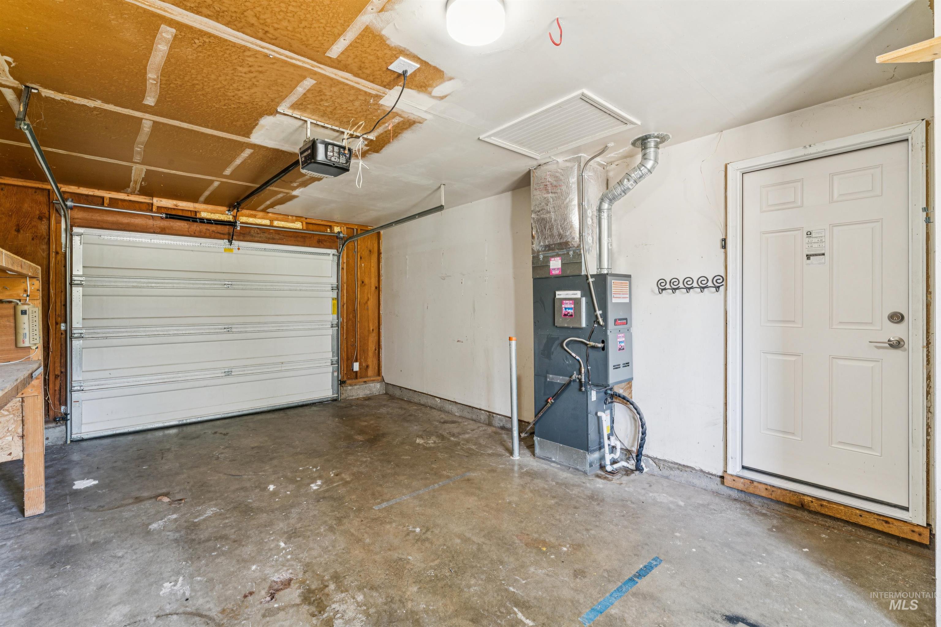 Garage with a garage door opener and heating unit