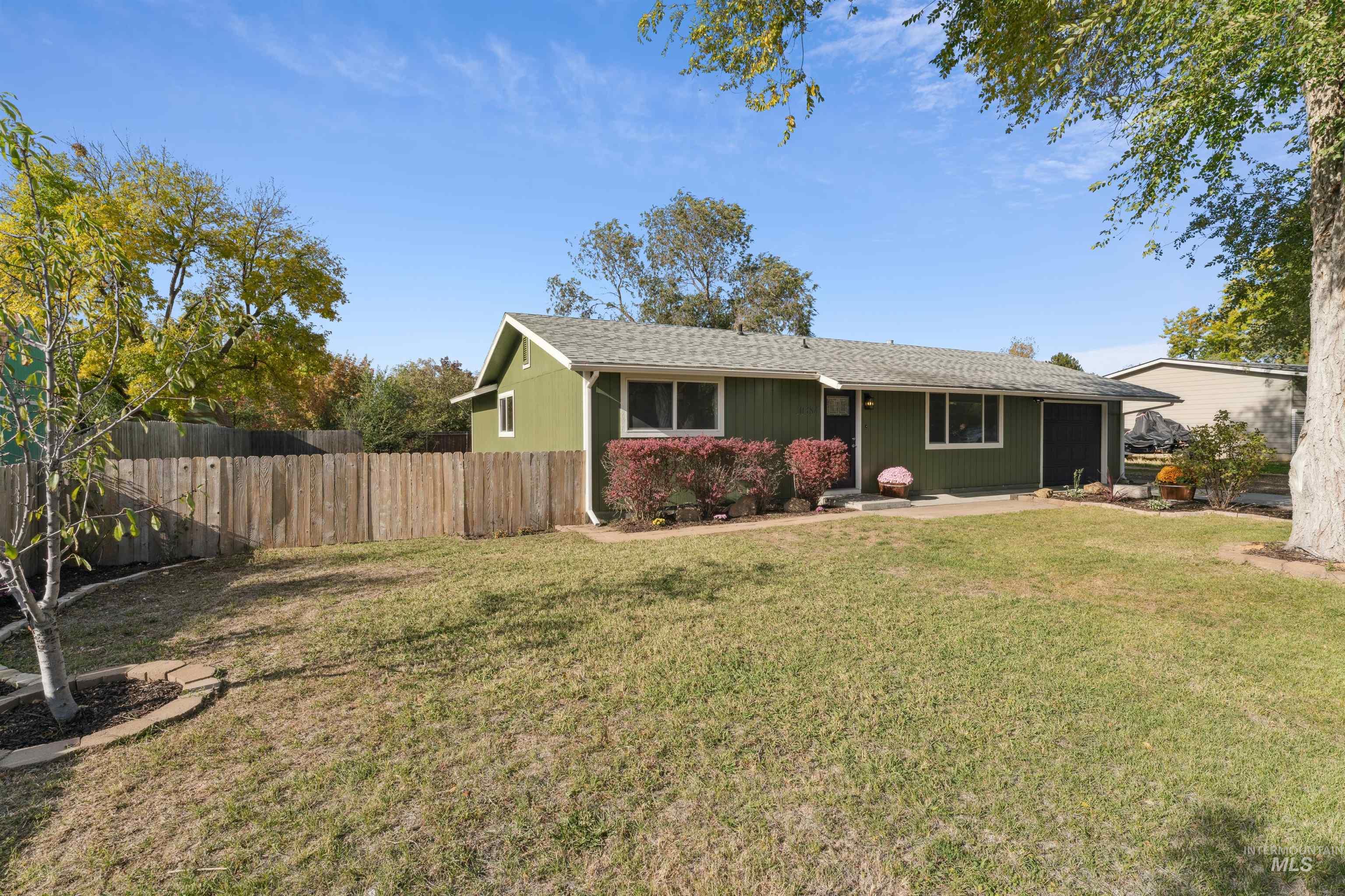 Ranch-style home with roof with shingles and a sunroom
