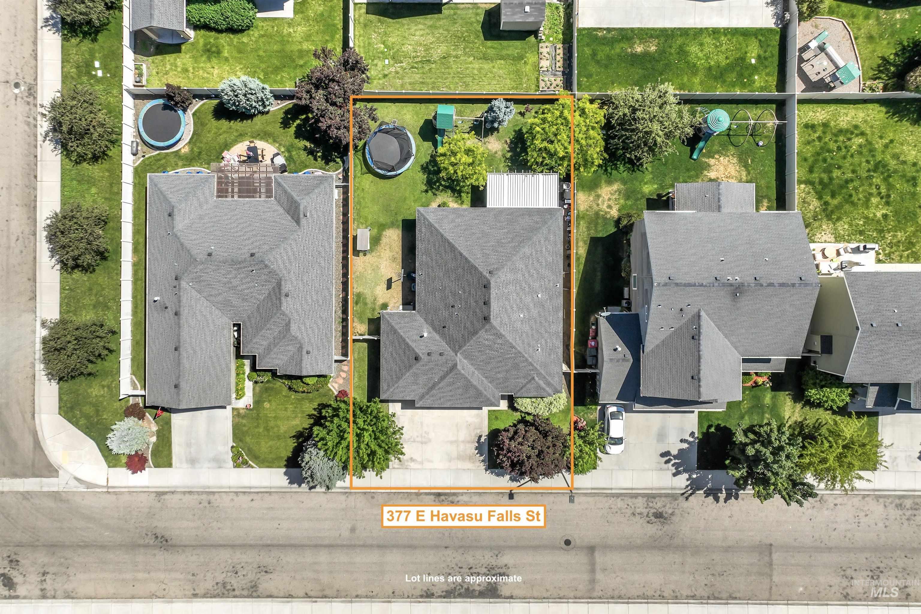 Aerial perspective of suburban area featuring property parcel outlined