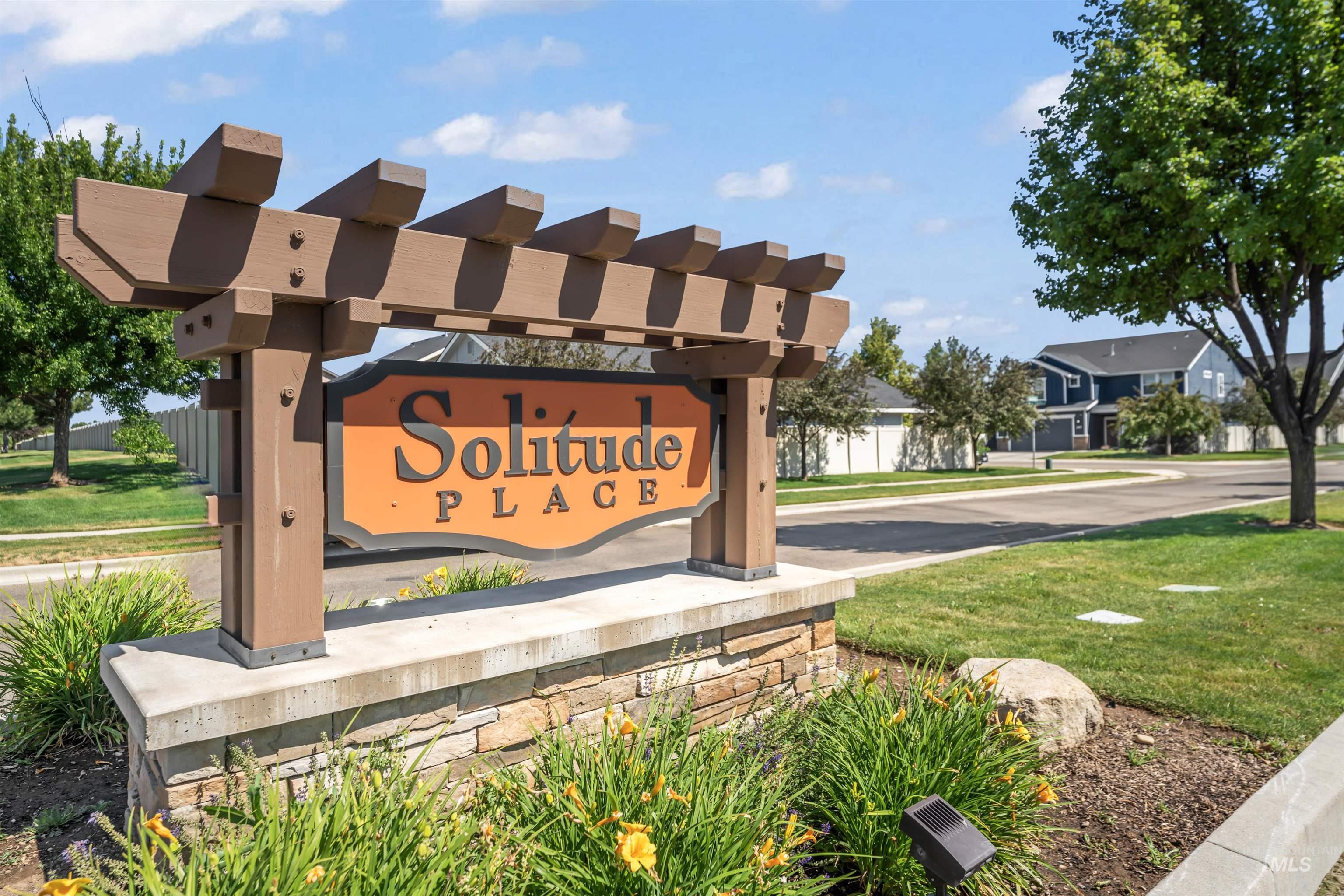 Community sign featuring a yard