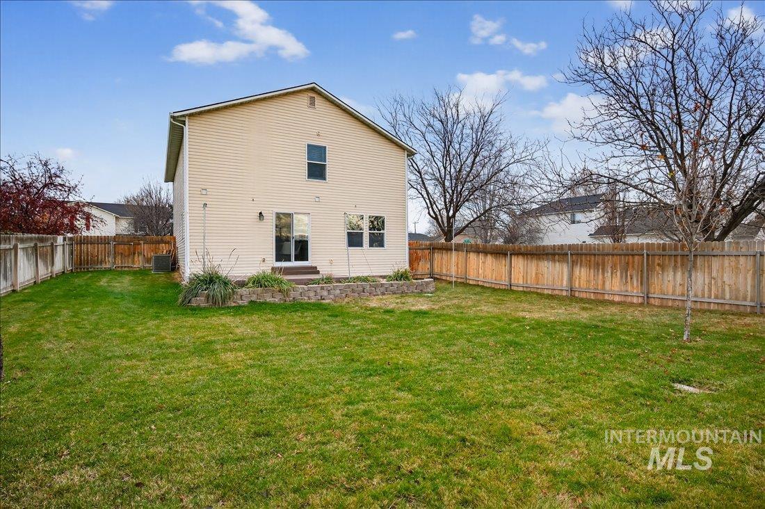 Back of house featuring a fenced backyard
