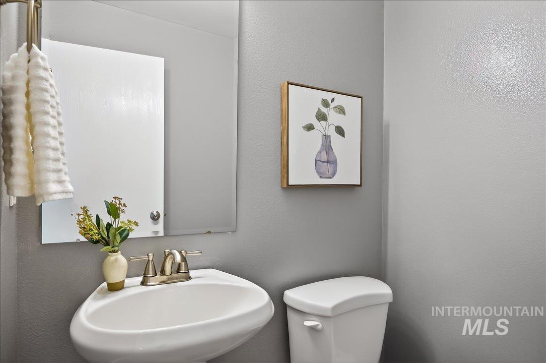 Half bath with a textured wall