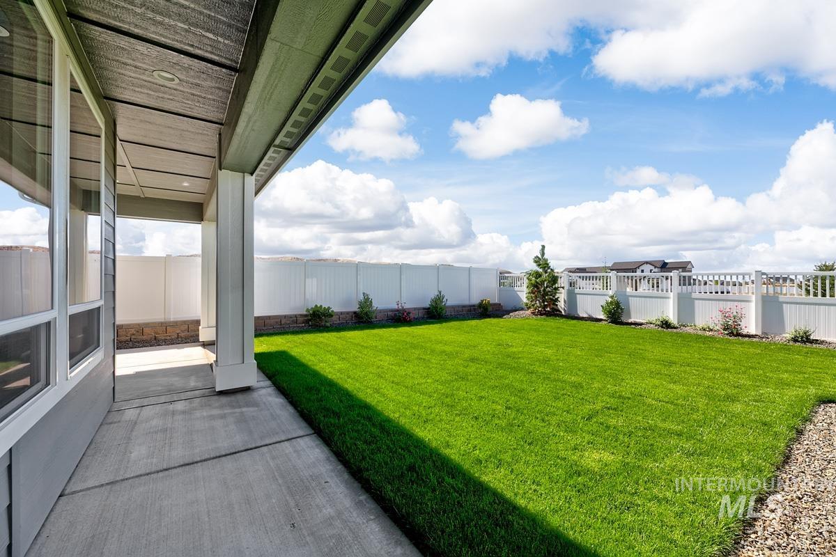 Fenced backyard featuring a patio