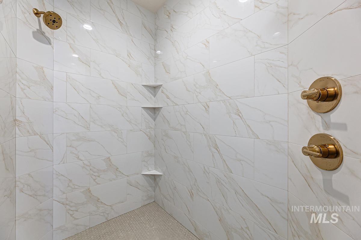 Full bathroom with tiled shower