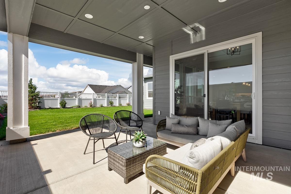 Fenced backyard with a patio area and an outdoor hangout area