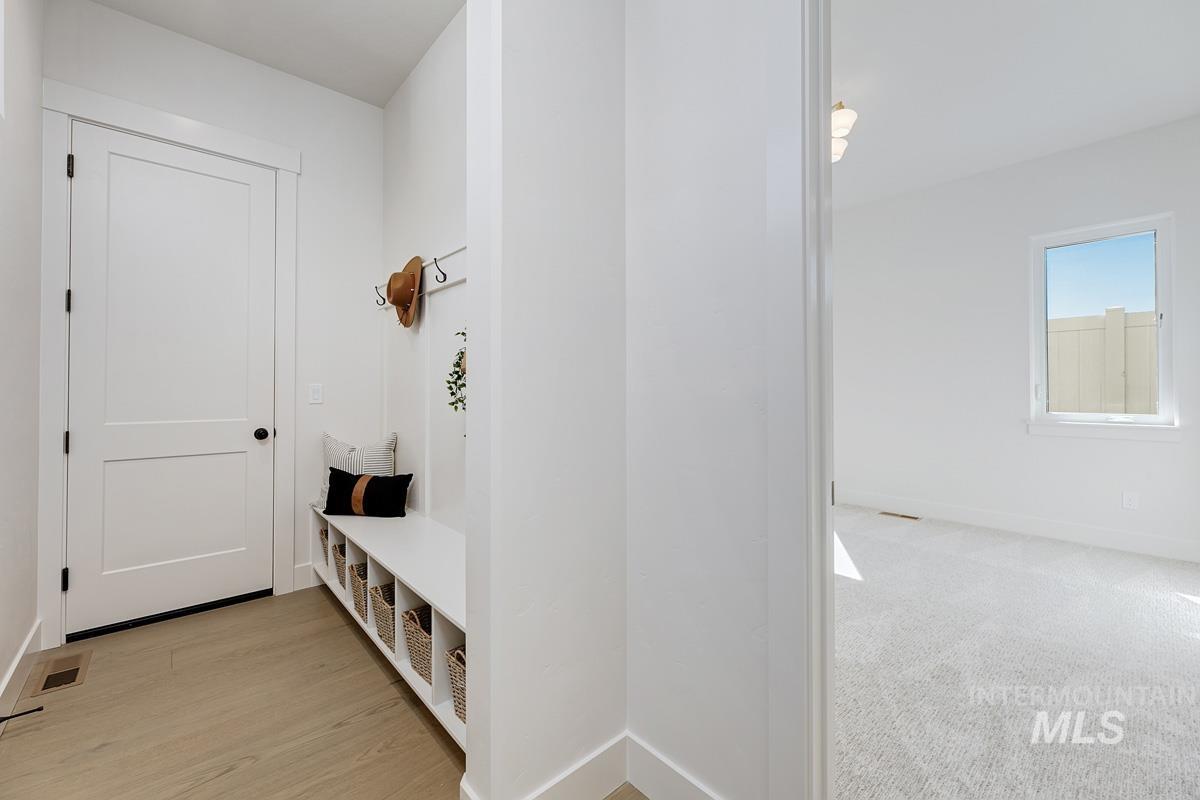 Mudroom featuring baseboards
