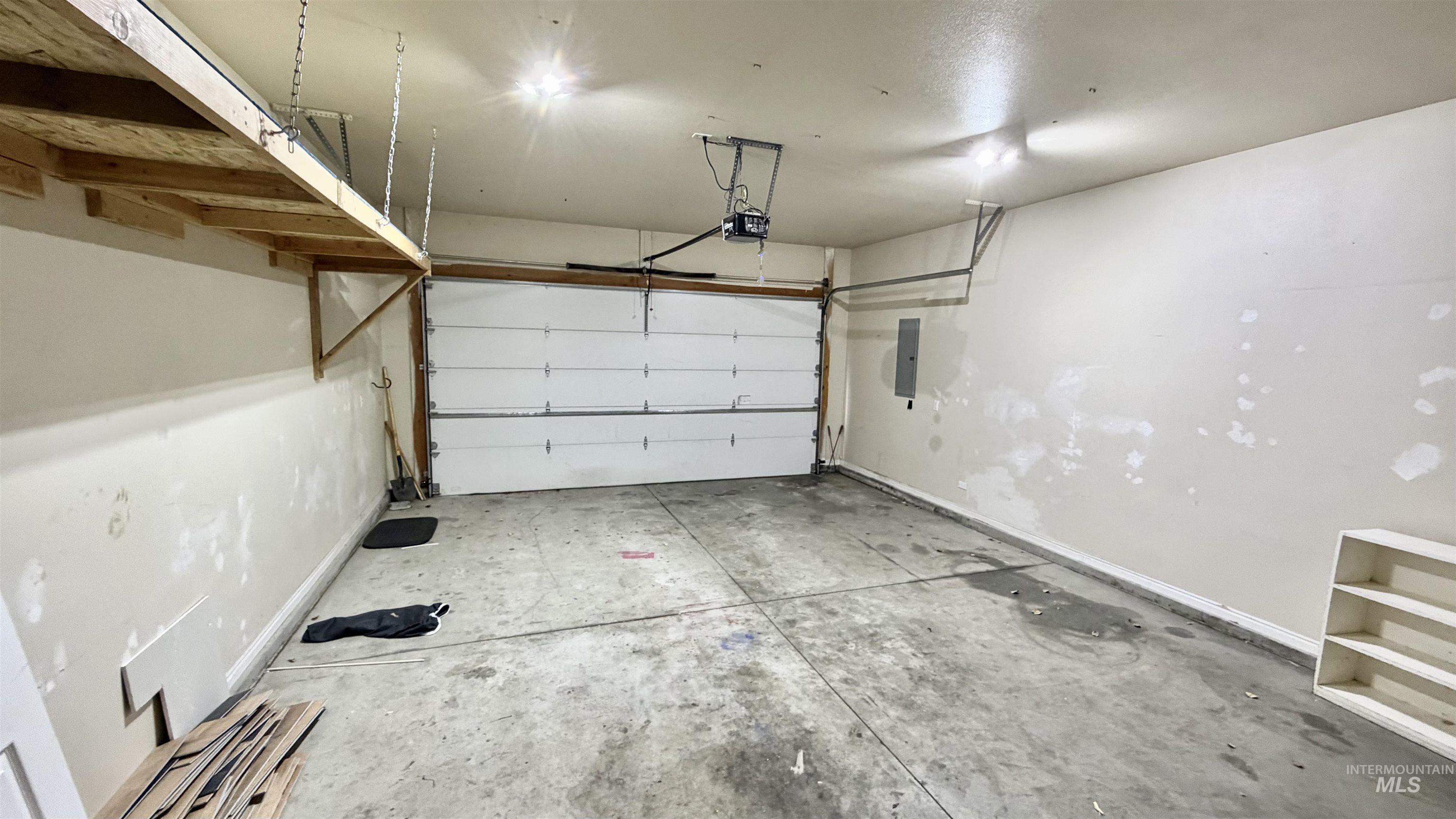 Garage featuring electric panel