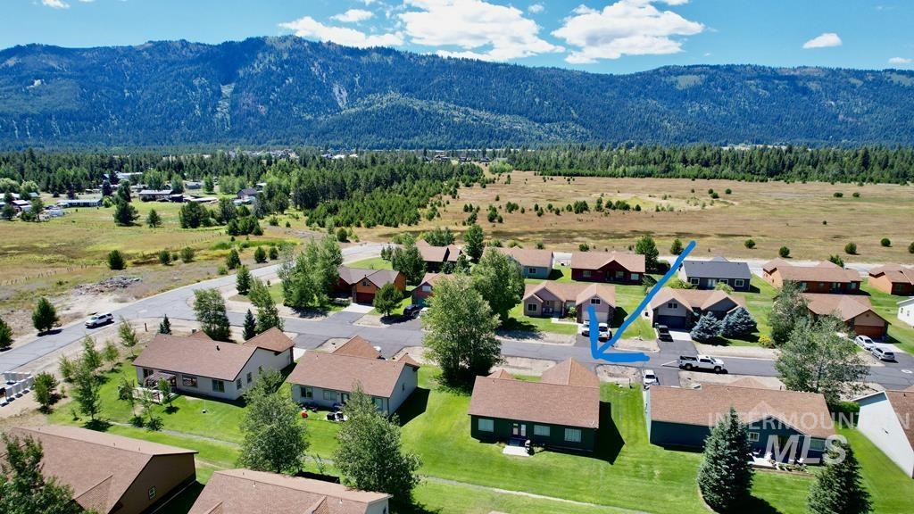 Aerial view of residential area featuring a mountainous background