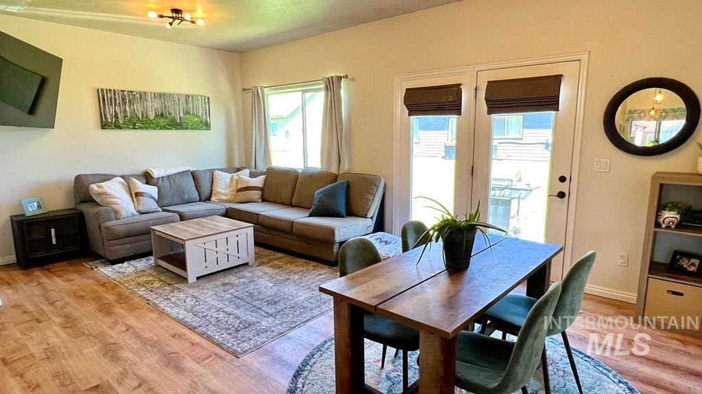 Living room with light wood finished floors and baseboards
