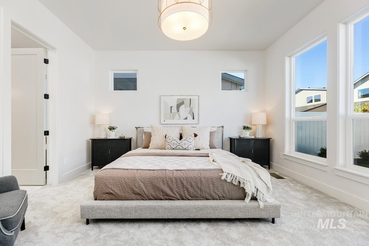 Carpeted bedroom with baseboards