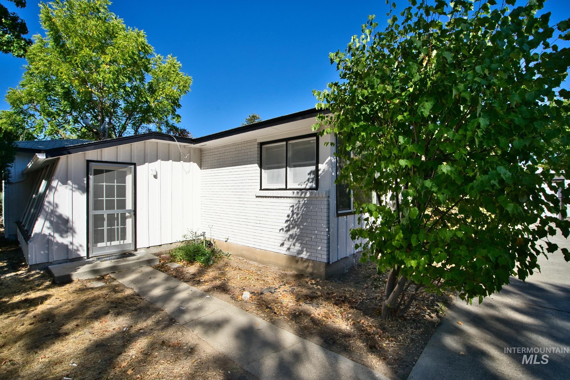 View of front of house featuring board and batten siding