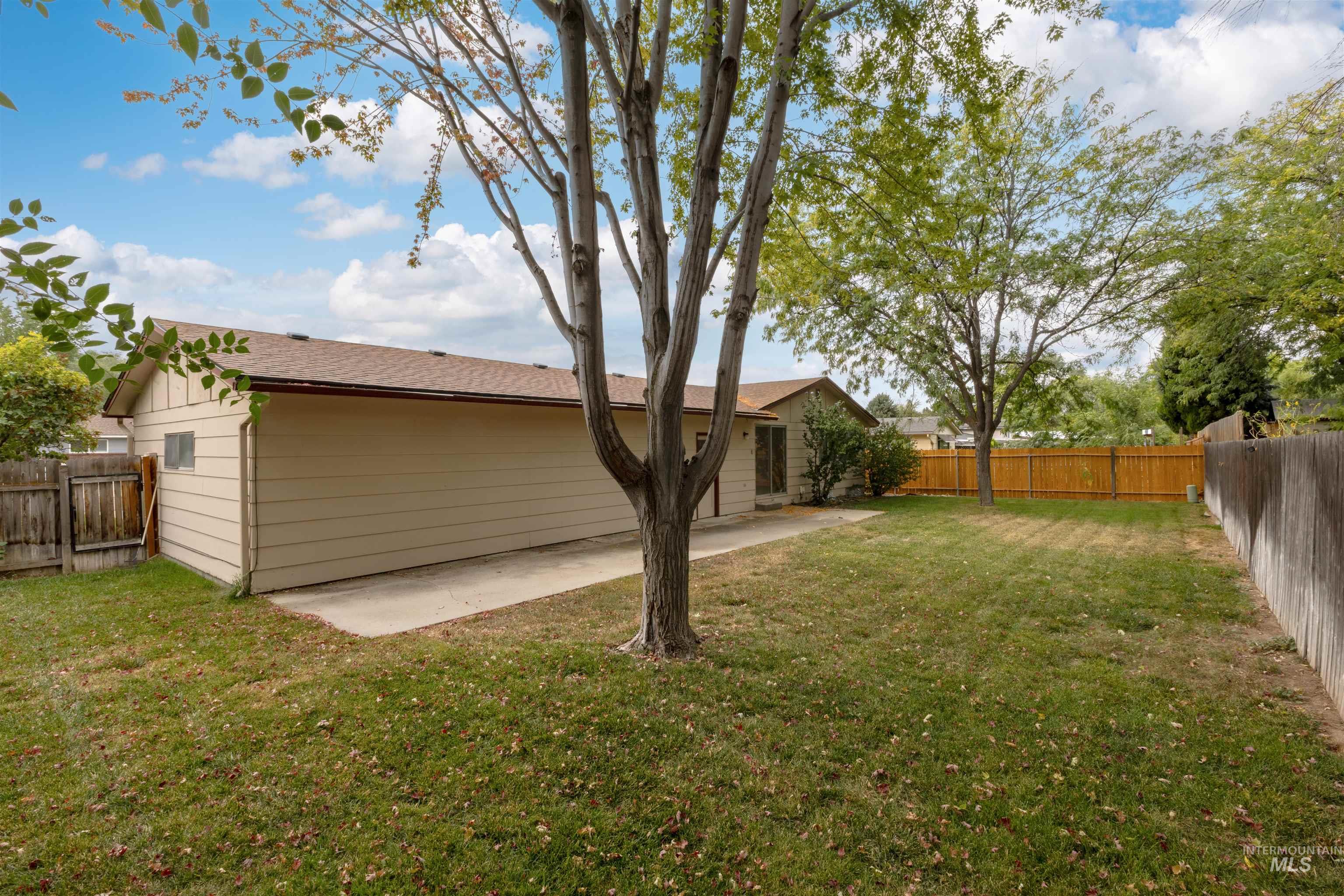 Fenced backyard featuring a patio area