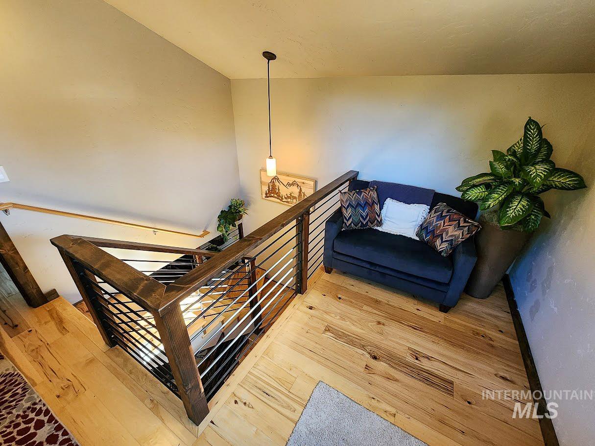 Stairs with hardwood / wood-style flooring