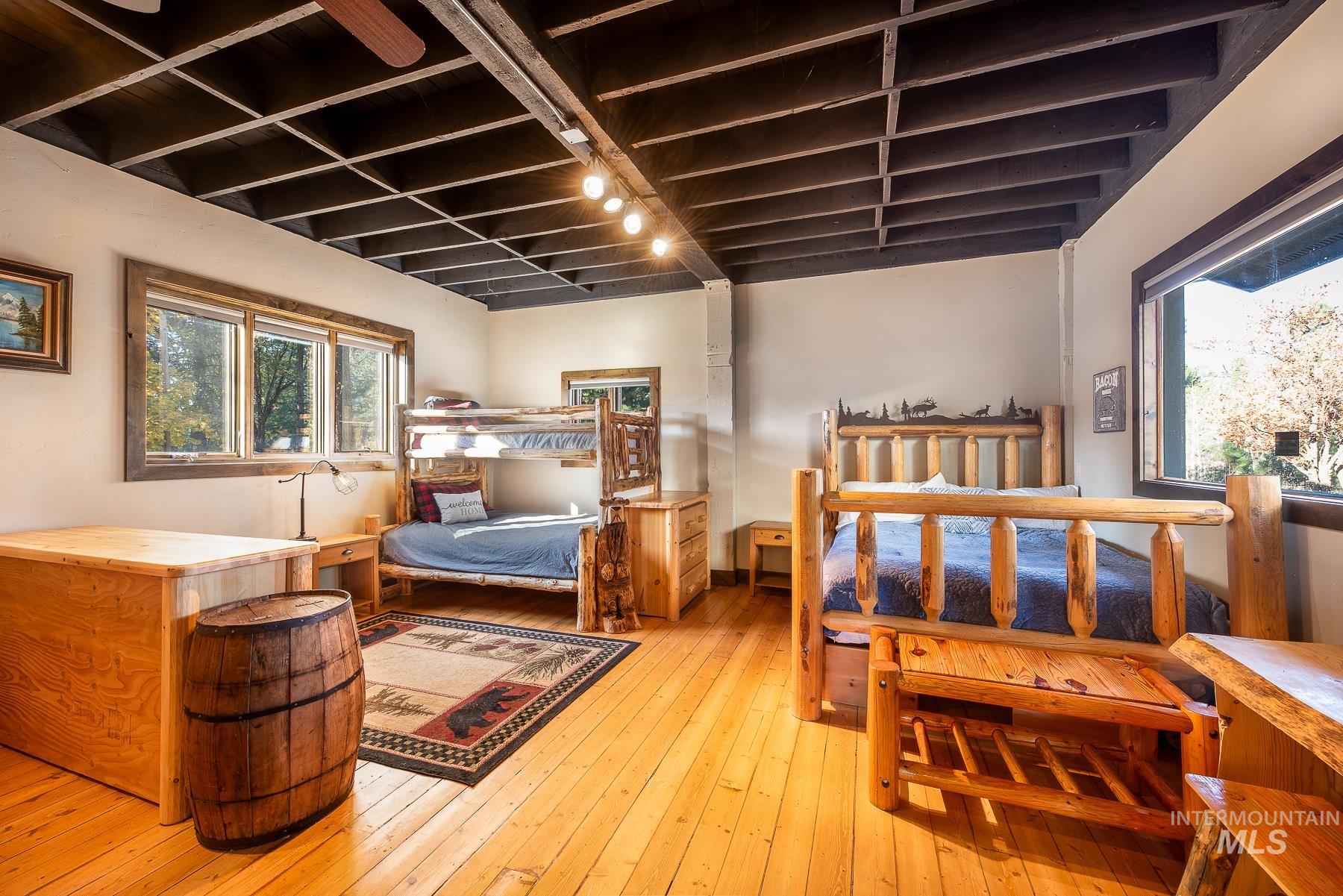 Bedroom with wood-type flooring
