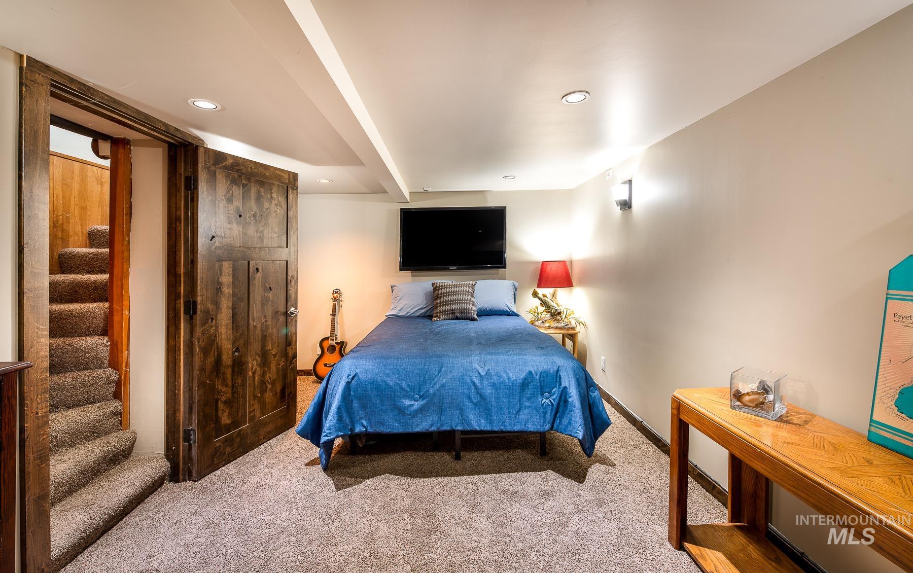 Carpeted bedroom with baseboards