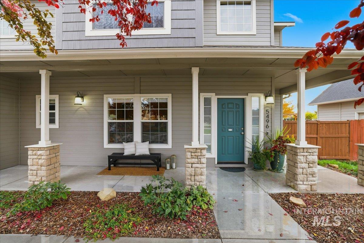 Entrance to property featuring covered porch
