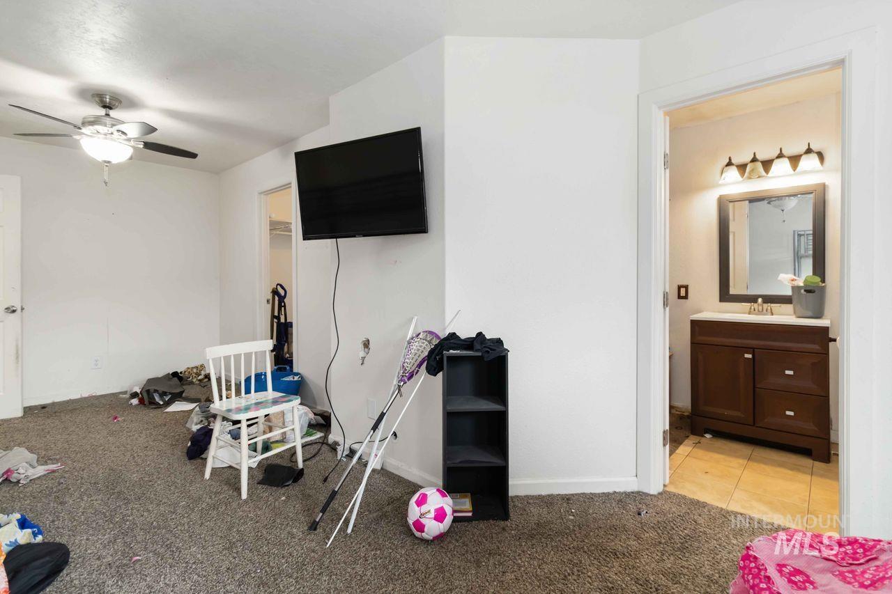 Game room featuring light colored carpet and ceiling fan