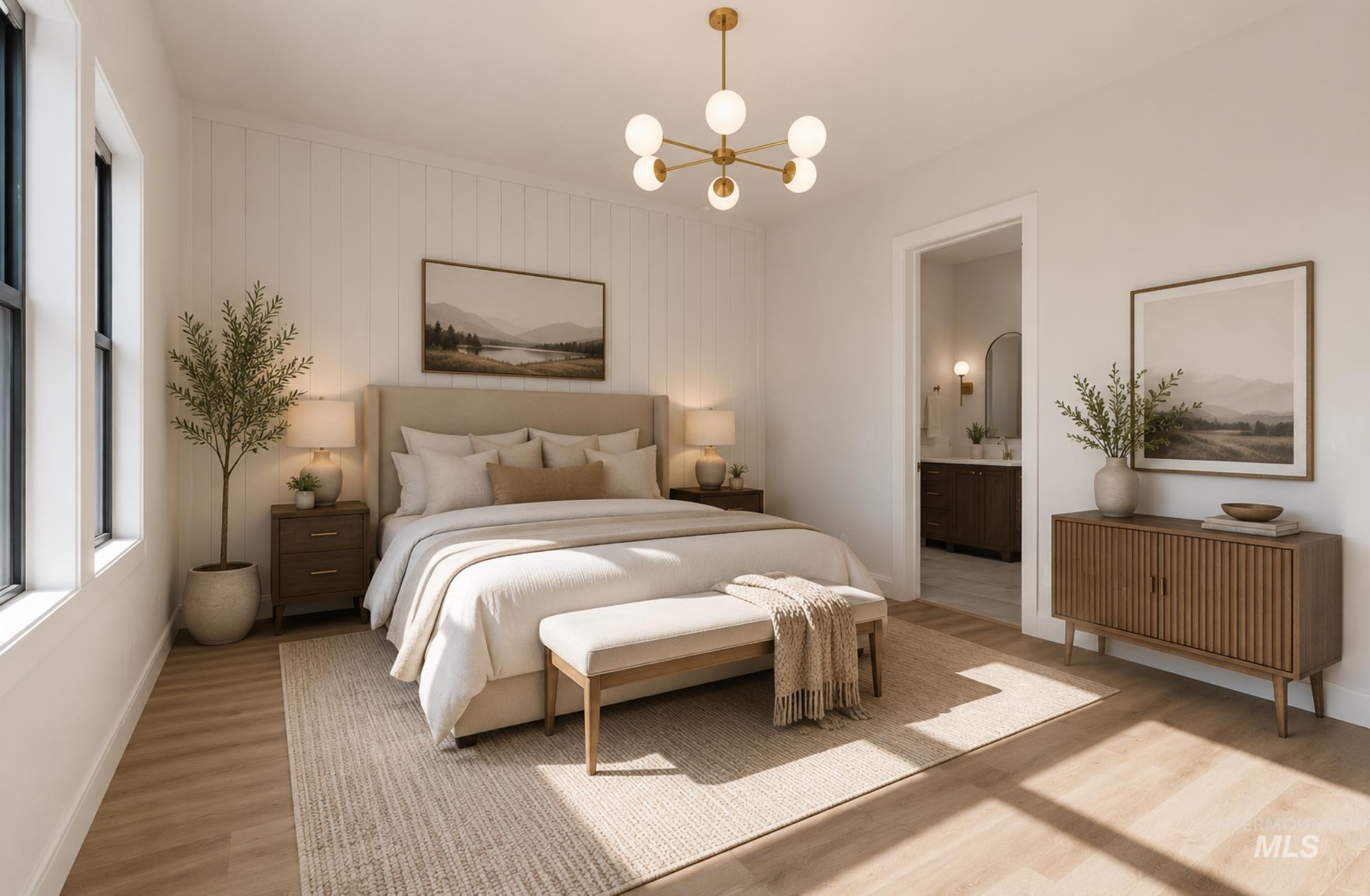 Light wood-finish flooring complements the bright white walls and trim