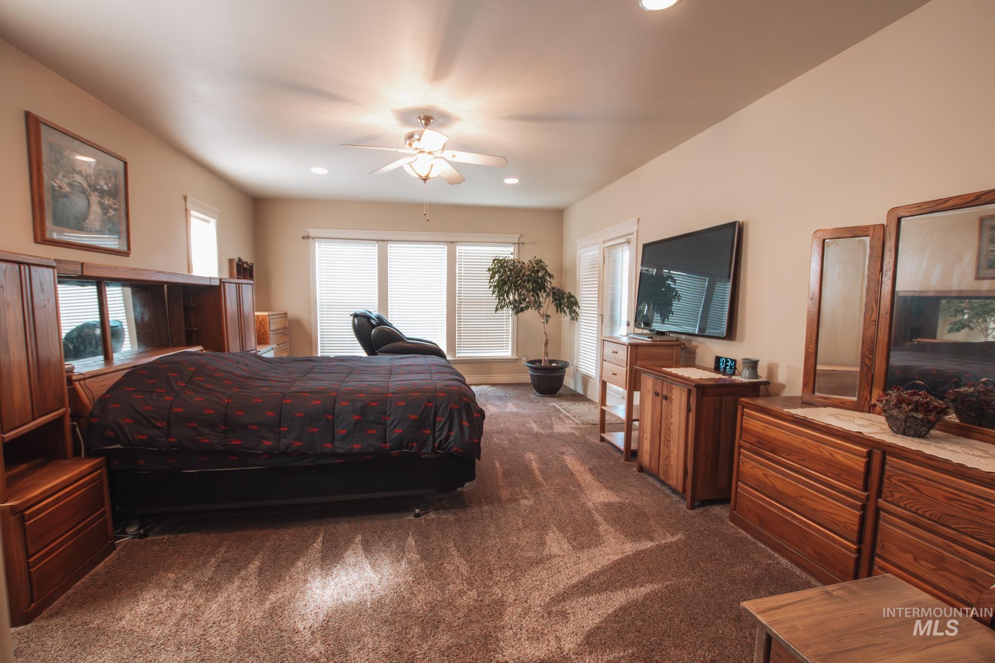 Bedroom with carpet floors, recessed lighting, and a ceiling fan