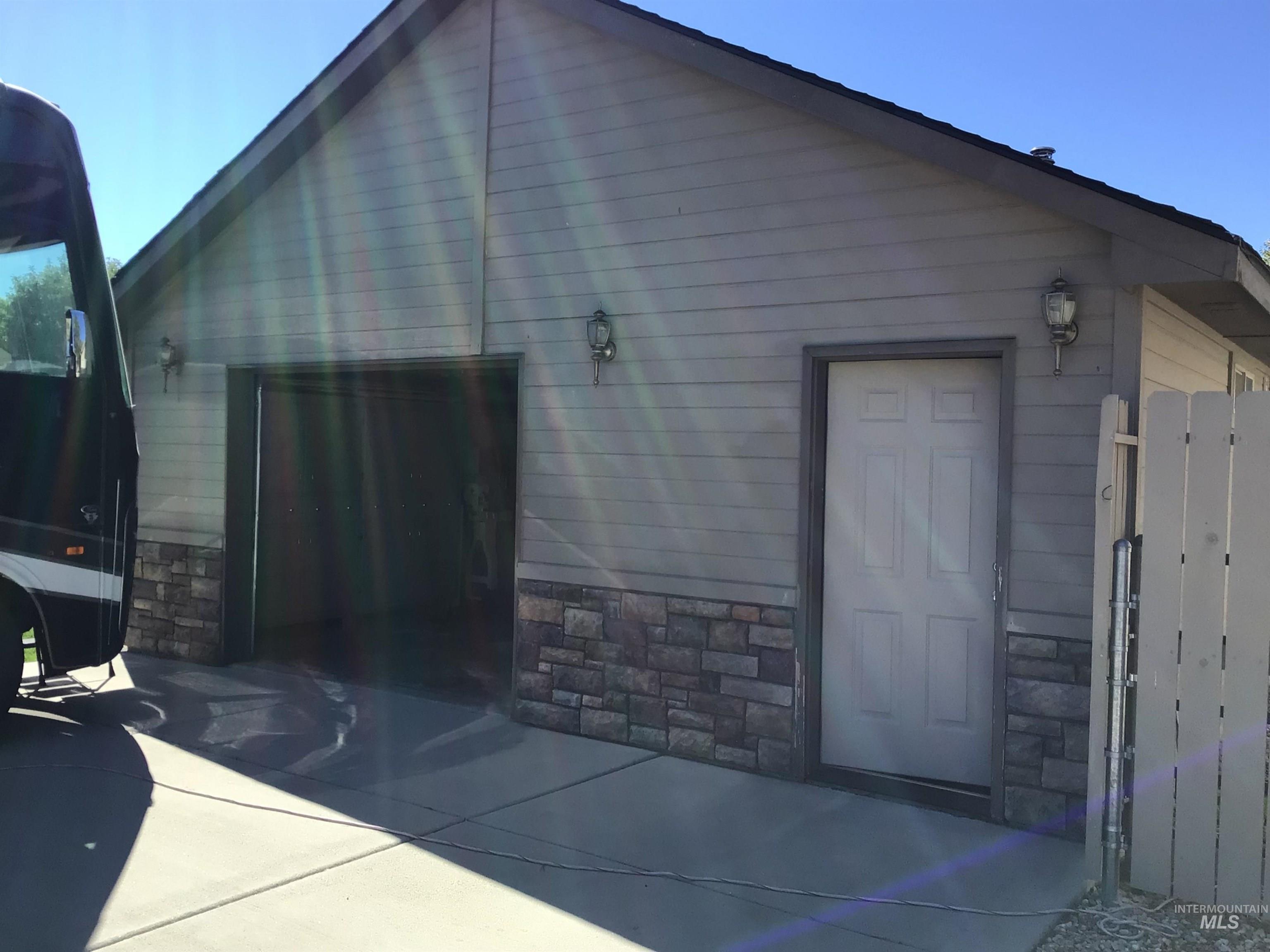 View of outdoor structure with a garage