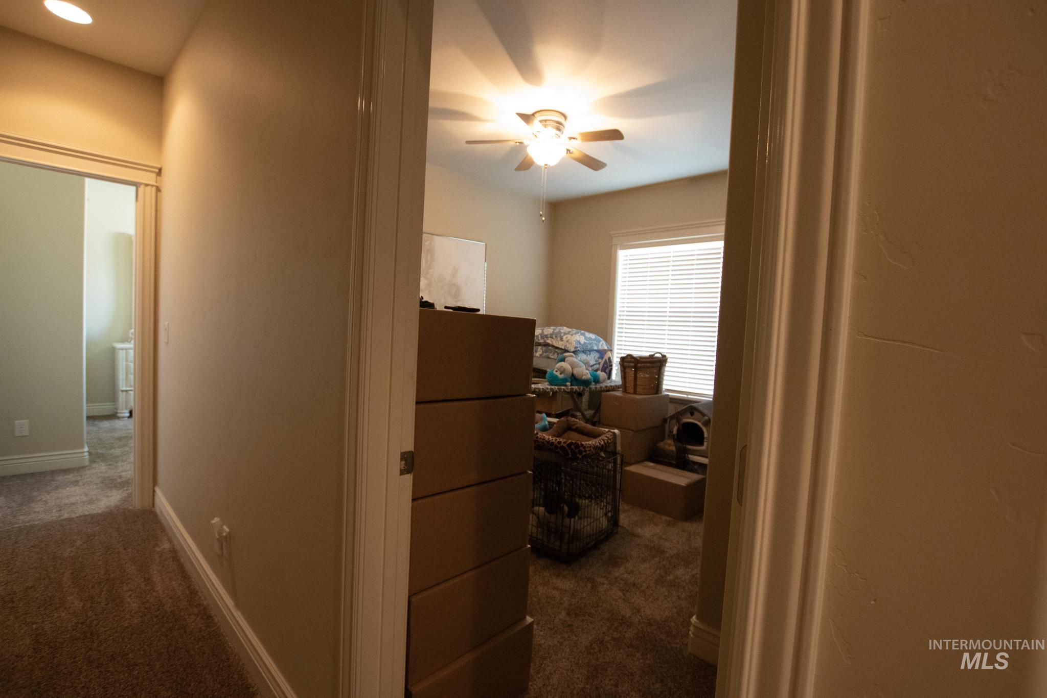 Hall with dark colored carpet