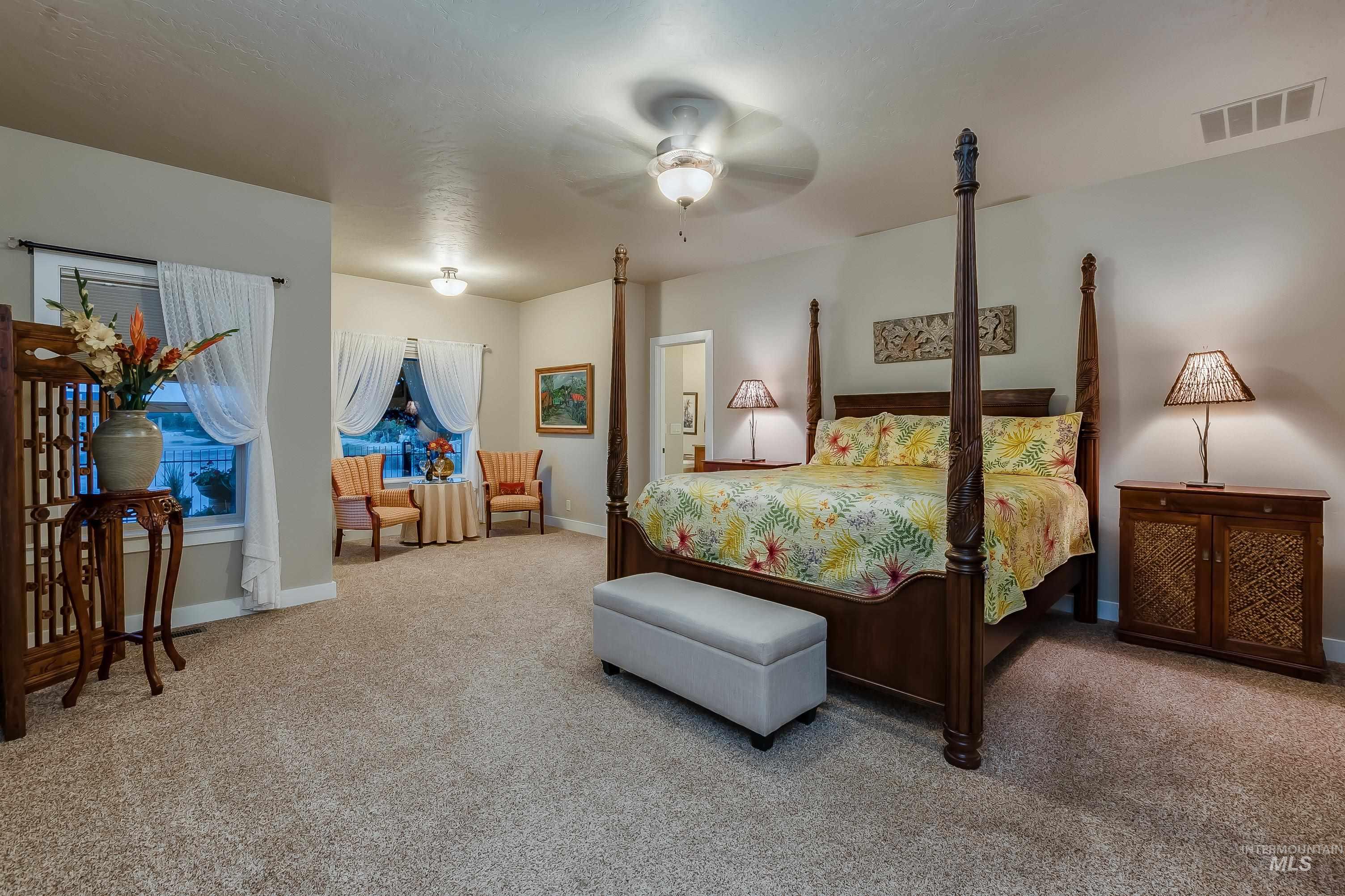 Bedroom featuring carpet floors and a ceiling fan