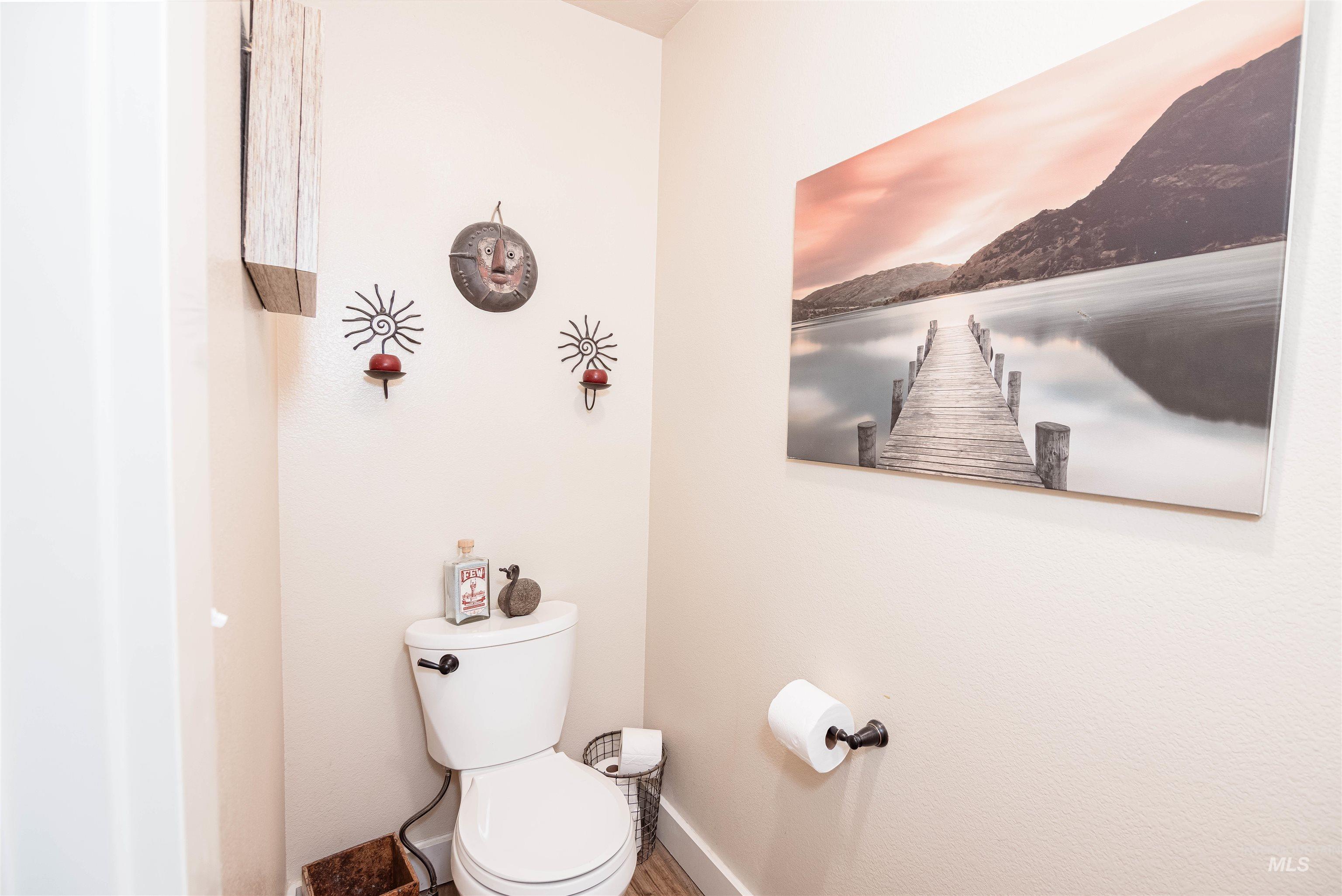 Neutral tone wall paint with wood-finish flooring
