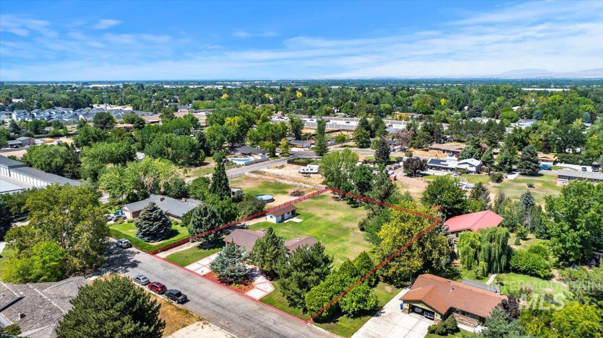 Aerial view of residential area with property boundaries highlighted