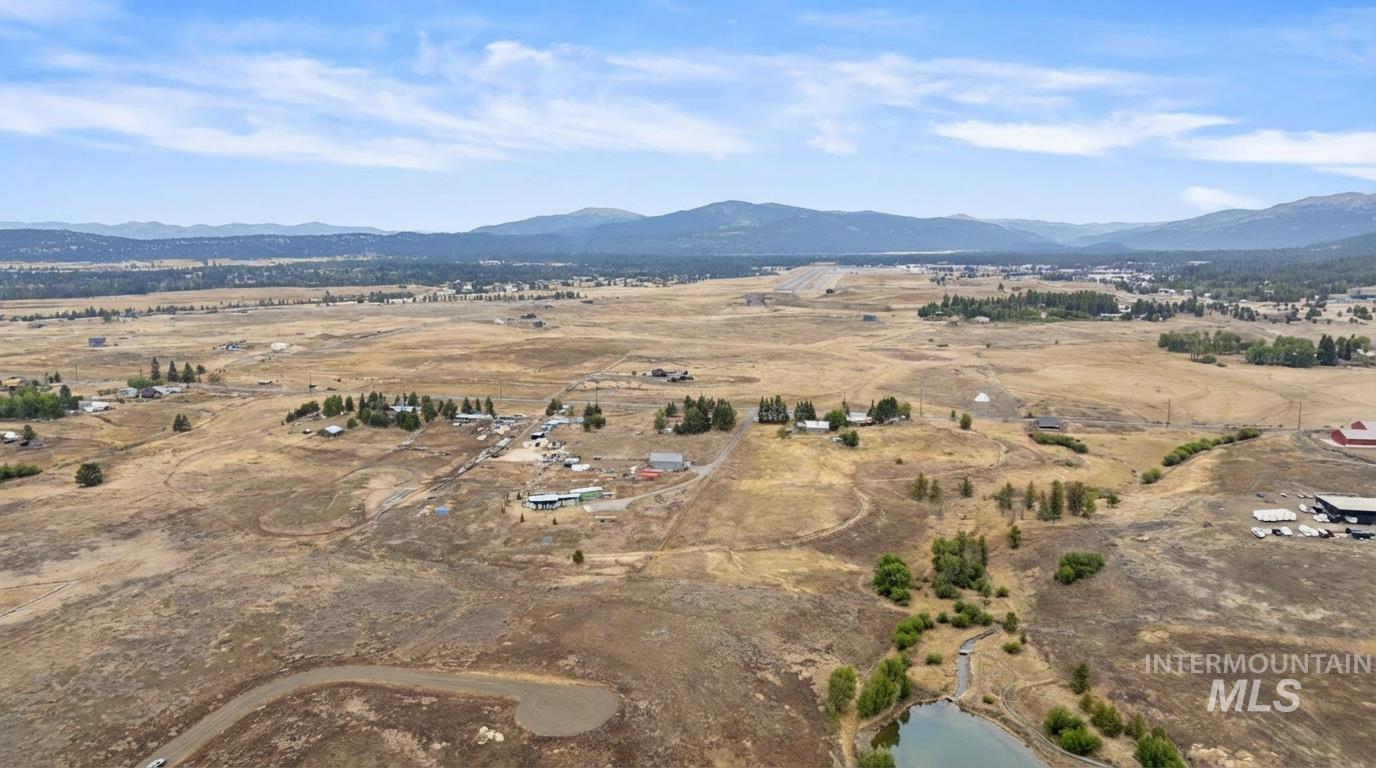 Overview of rural landscape featuring a mountainous background