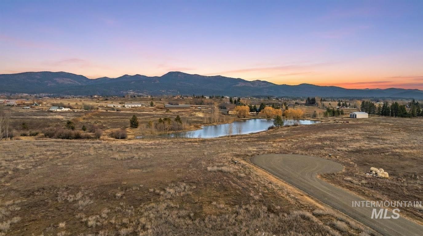 View of mountain backdrop featuring a large body of water