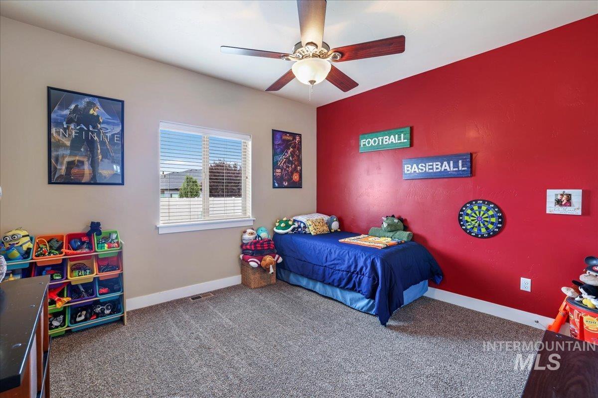 Bedroom featuring carpet floors and ceiling fan