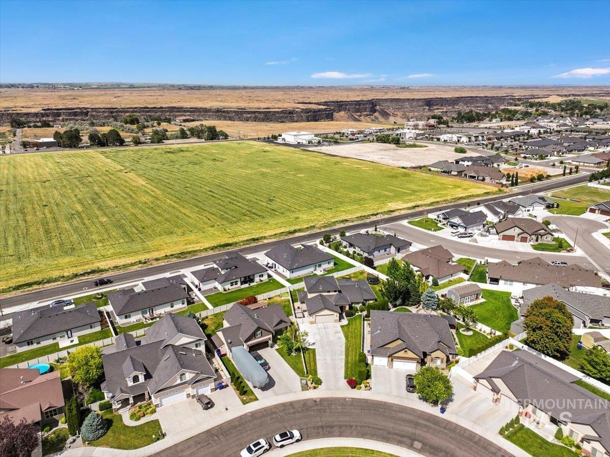 Aerial view of property's location featuring nearby suburban area and rural landscape