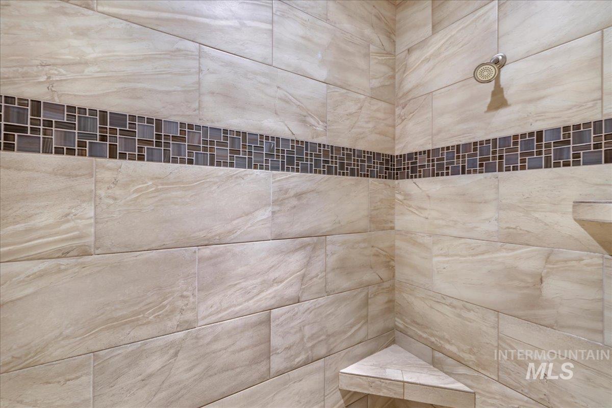 Bathroom view of a tile shower