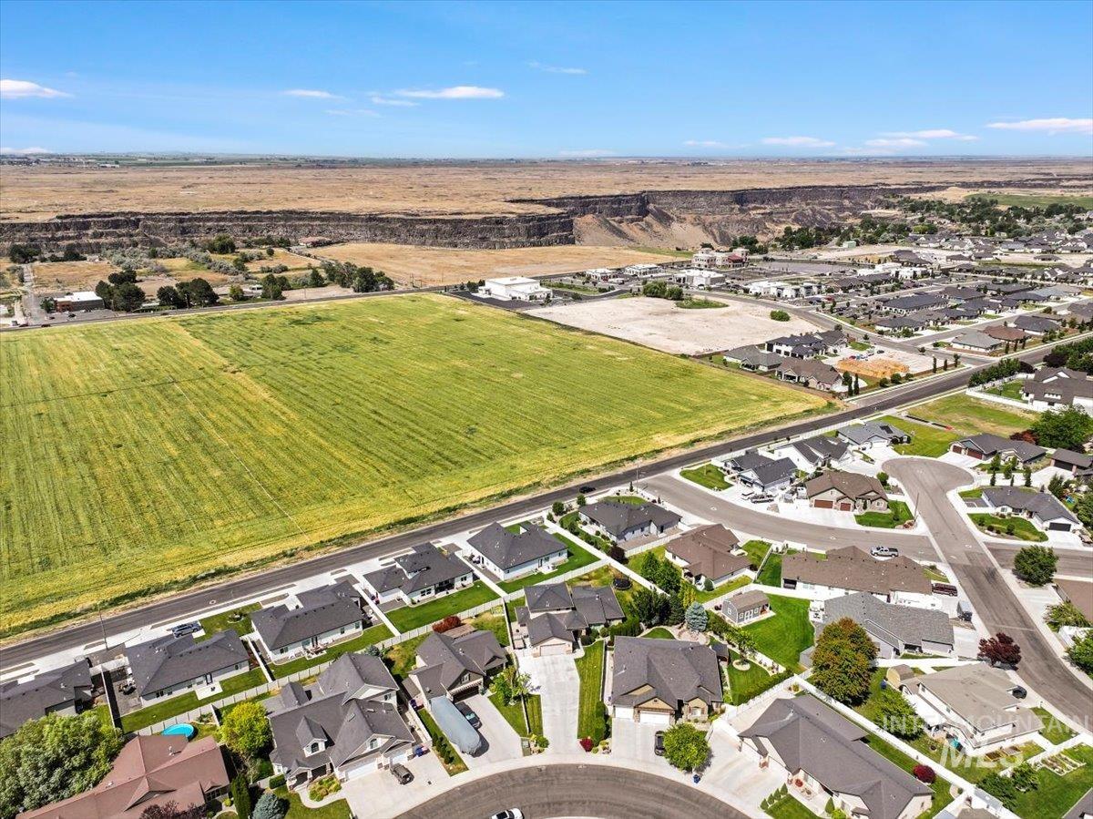 Aerial overview of property's location with nearby suburban area and rural landscape