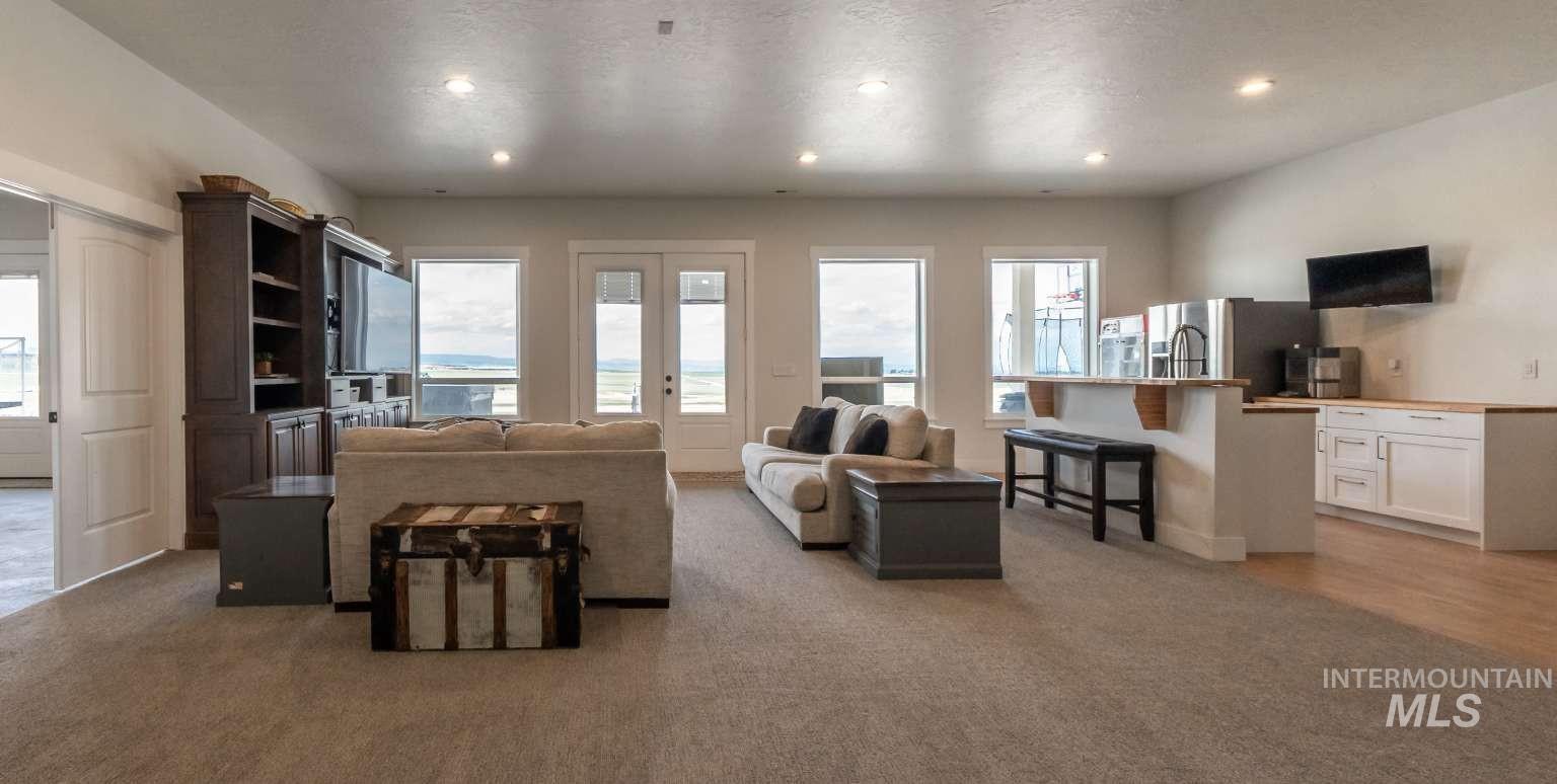 Living room featuring recessed lighting and light carpet