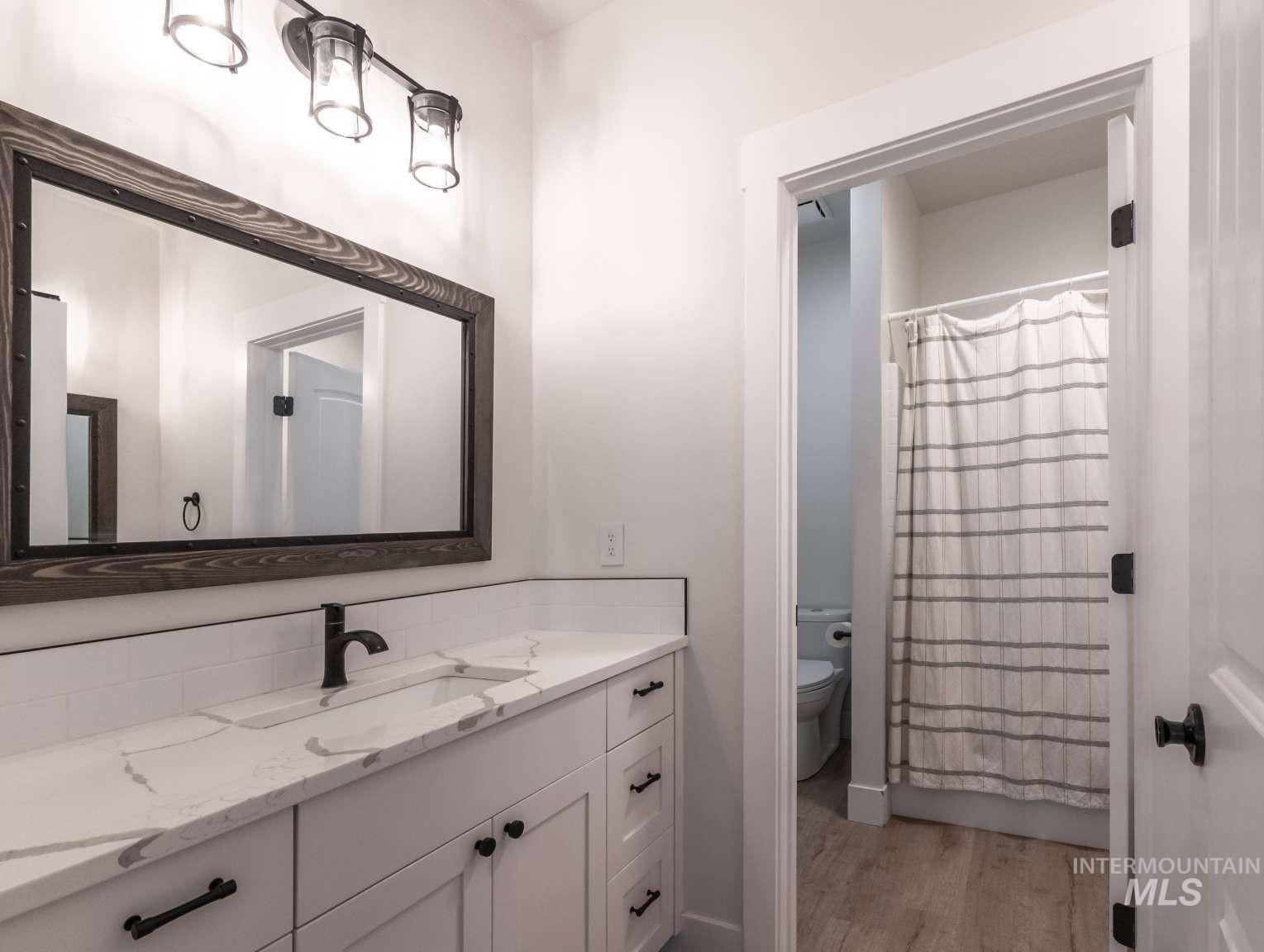 Bathroom featuring vanity and light wood-style flooring