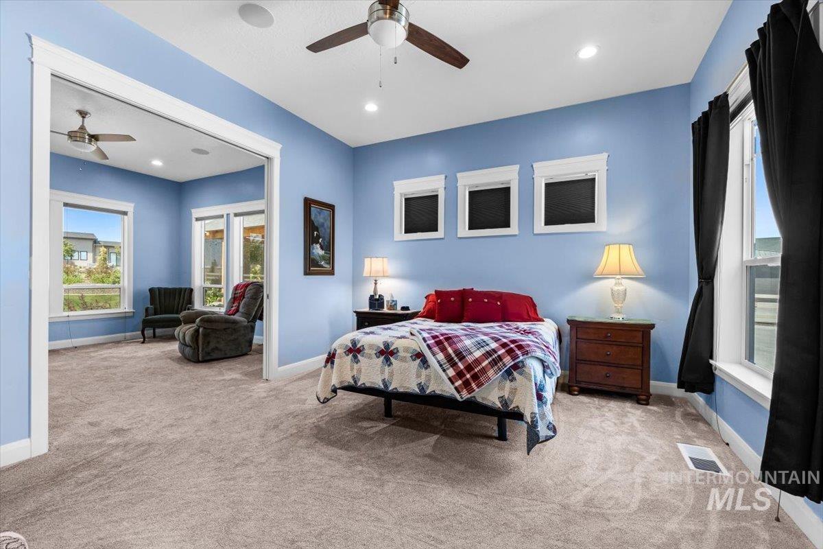 Bedroom with light carpet, access to outside, recessed lighting, and a ceiling fan