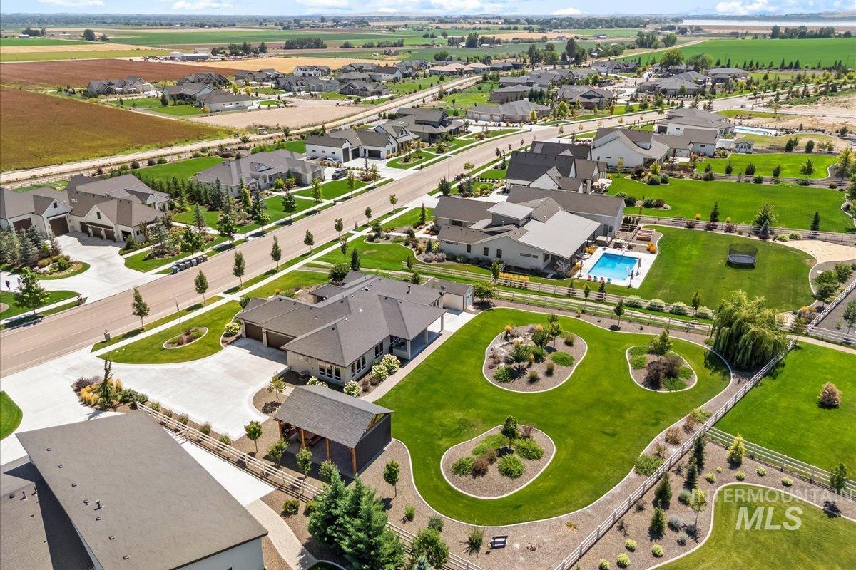 Aerial perspective of suburban area with a pool