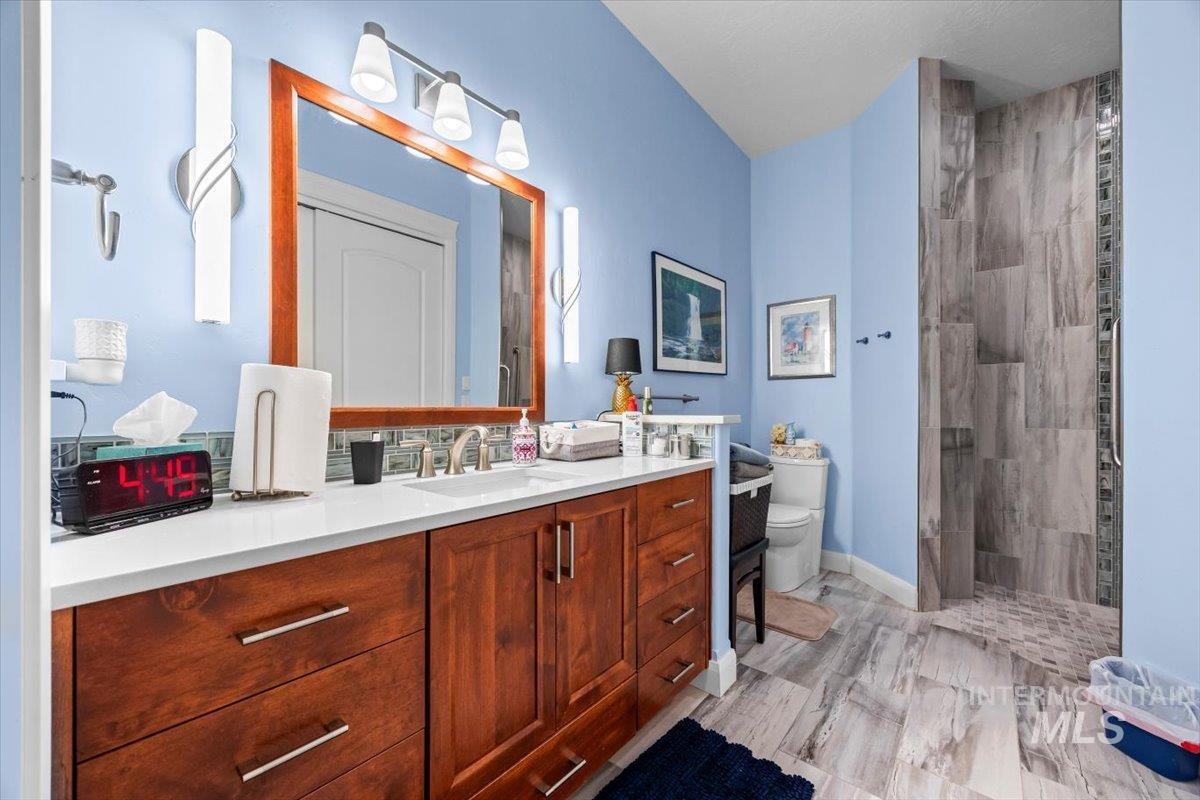 Bathroom featuring vanity and walk in shower