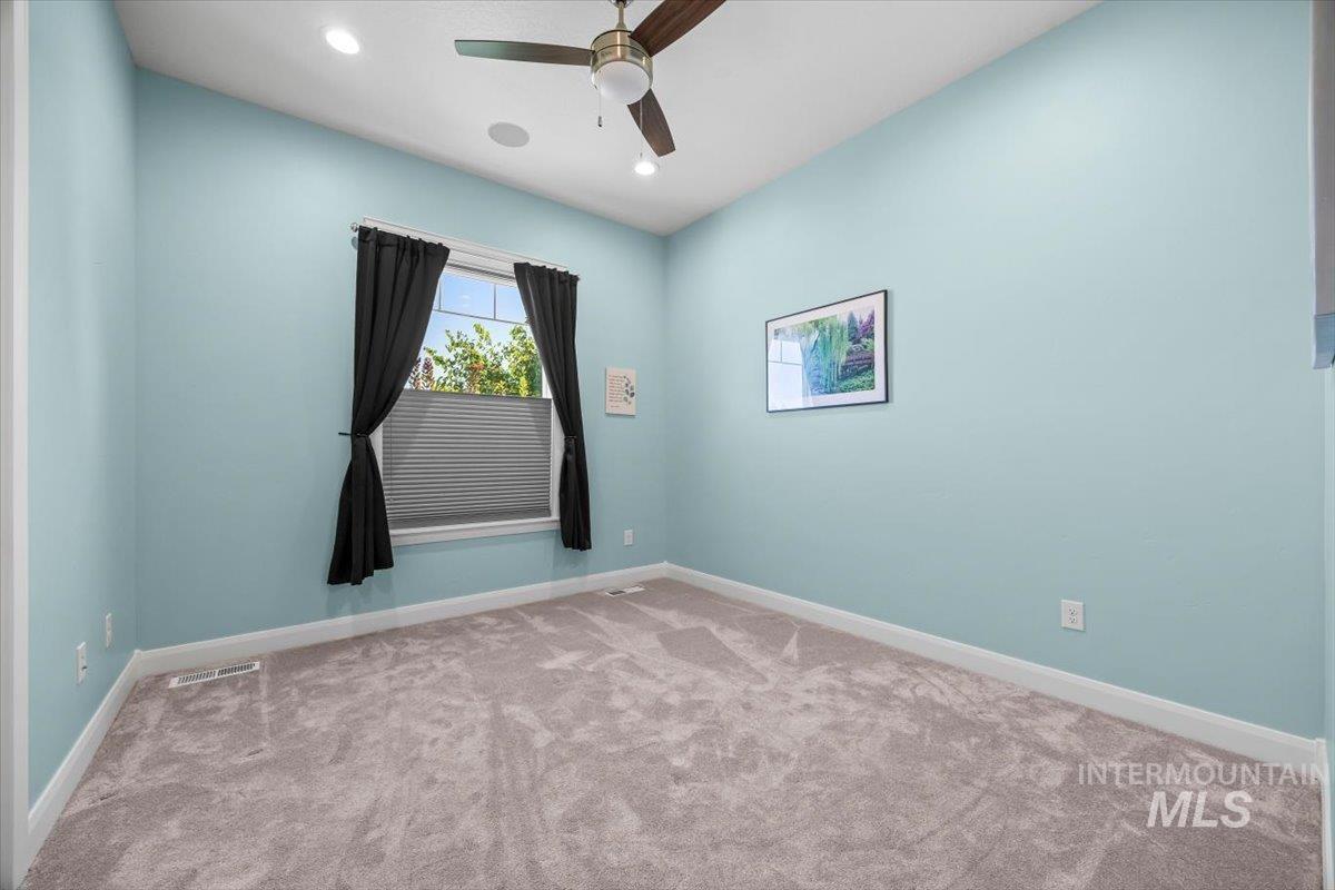 Unfurnished room with carpet flooring, recessed lighting, and a ceiling fan
