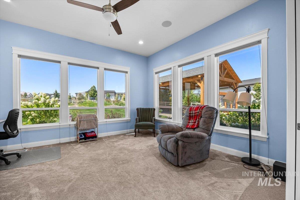 Living area with carpet floors, recessed lighting, a desk, and ceiling fan