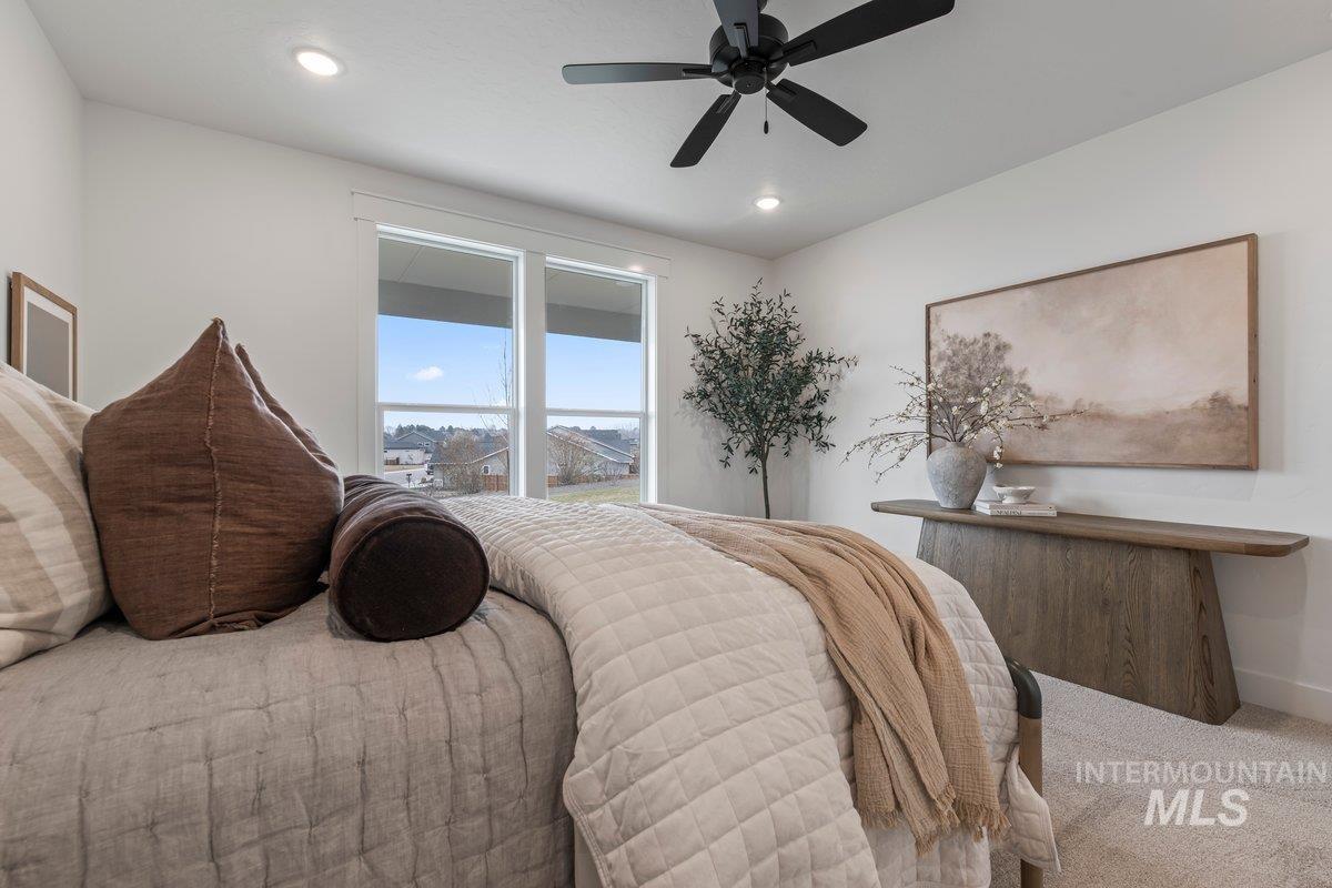 Bedroom featuring ceiling fan, carpet flooring, and recessed lighting