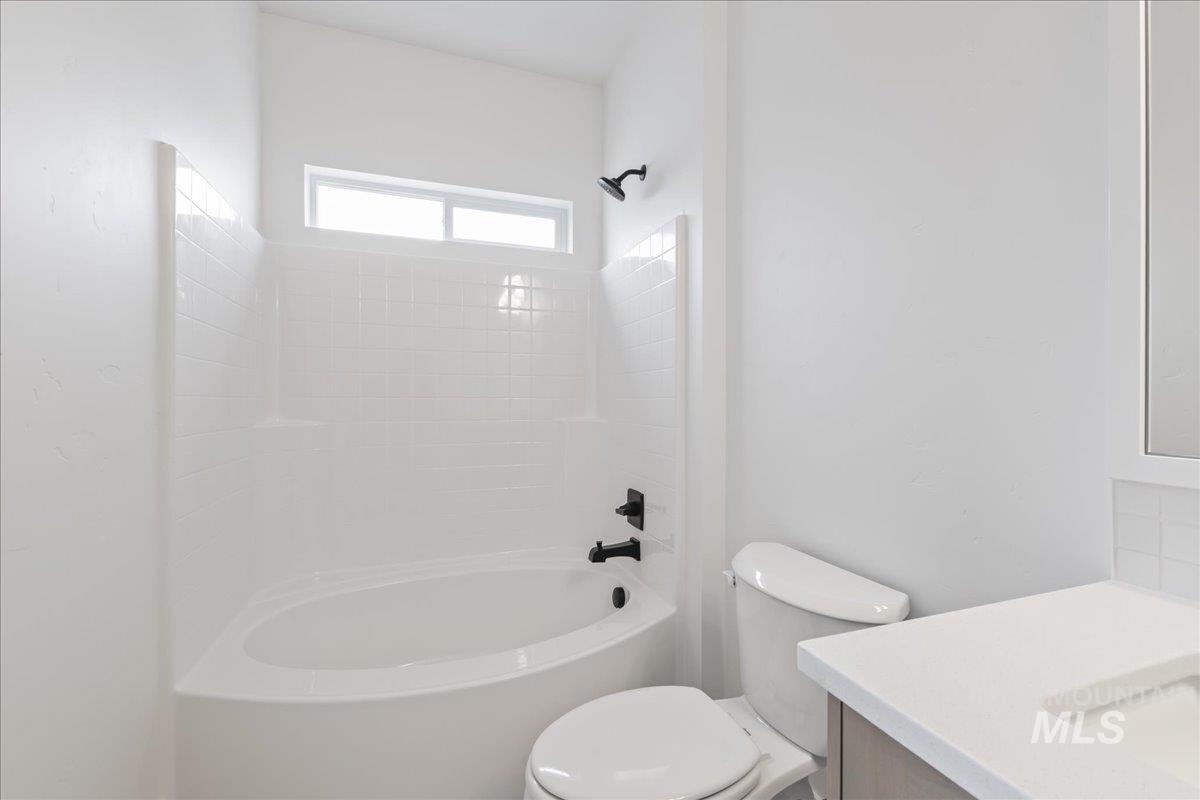 Bathroom with tub / shower combination and vanity
