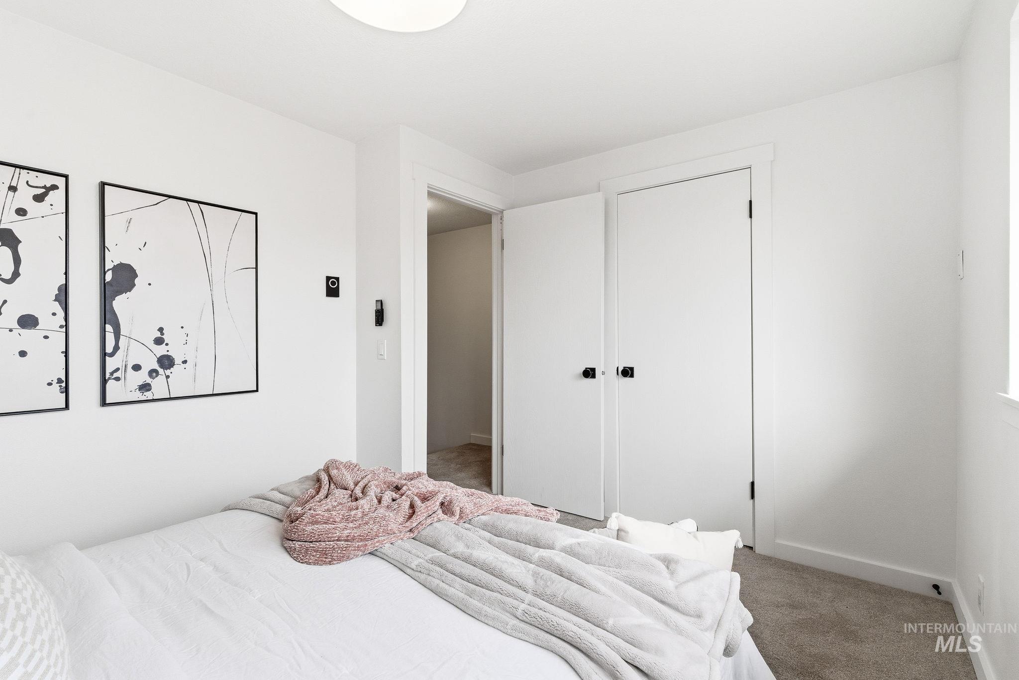Carpeted bedroom with baseboards